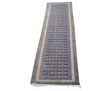 Late 19th-century Harati runner, indigo blue field, repeating pattern, multi-banded border.347cm (136") x 110cm (43")Conditio