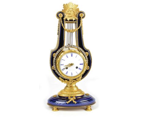 Perrin A Paris French mantel clock of classical design, 8-day movement striking on a single bell, white enamel dial with blue