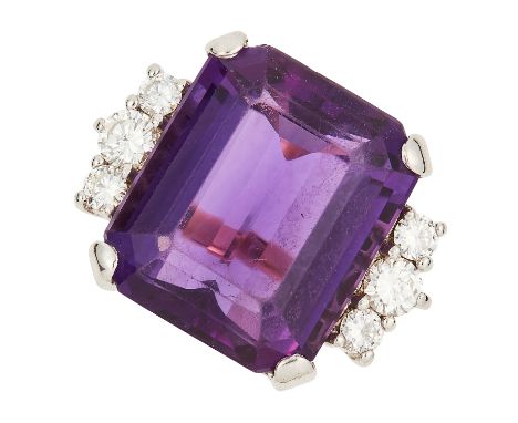 AMETHYST AND DIAMOND RING set with an emerald cut amethyst between round cut diamonds, size O / 7, 10.9g.