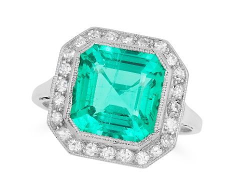 4.54 CARAT COLOMBIAN EMERALD AND DIAMOND RING set with an emerald cut emerald of 4.54 carats in a border of round cut diamond