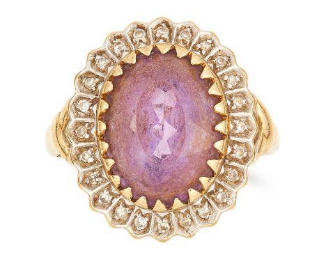 AMETHYST AND DIAMOND CLUSTER RING set with an oval cut amethyst in a border of round cut diamonds, size O / 7, 4.8g.