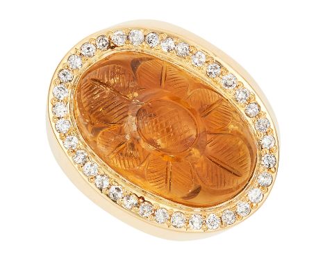VINTAGE CITRINE AND DIAMOND RING set with an oval citrine cabochon of 13.84 carats and round cut diamonds totalling 0.55 cara