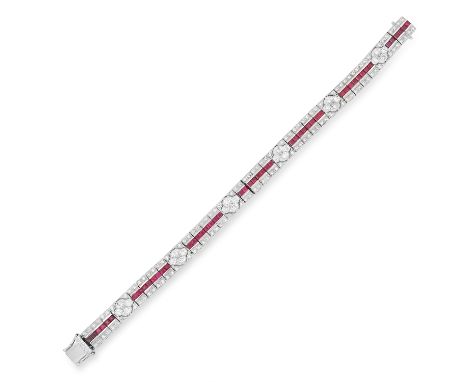 RUBY AND DIAMOND LINE BRACELET set with step cut rubies totalling approximately 3.64 carats and round cut diamonds totalling 