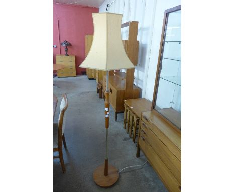 A teak standard lamp