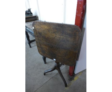 A George III oak square tilt-top tripod tea table