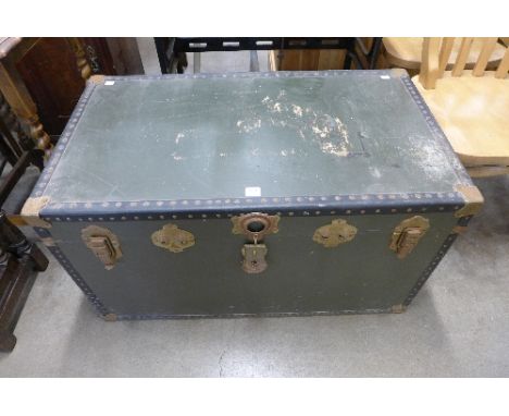 A green steamer trunk