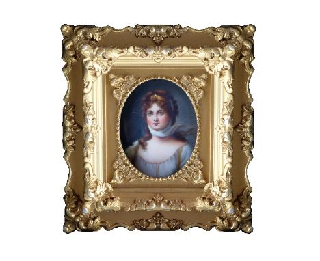 An early 19th Century portrait miniature of a lady, oval quarter length, on porcelain, 8.5 x 7cms, gilt frame