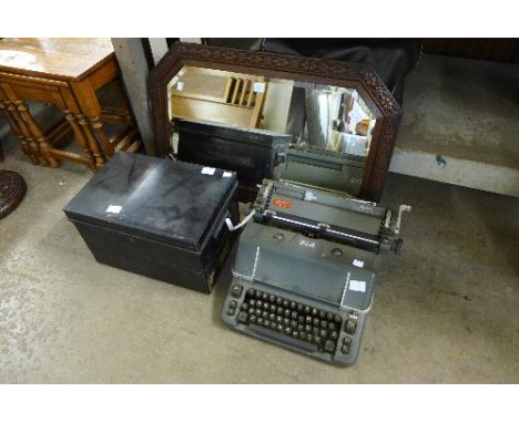 A Hermes typewriter, oak octagonal mirror and a steel box