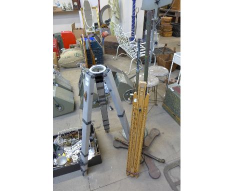 Three metal stands and easel