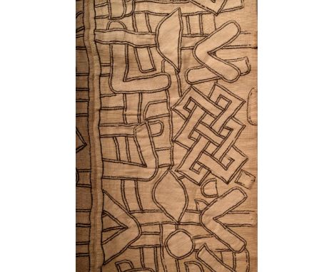 A Kuba embroided skirt D.R.Congo the stitched panels with abstract designs one end with rounded corners 215 x 87cm.  Provenan
