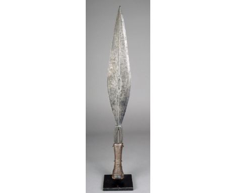 A Ngbandi knife D R Congo with slender leaf shape iron blade pierced with incised decoration with a wooden handle with metal 