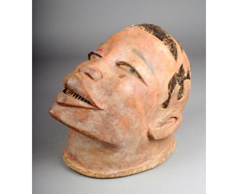 A Makonde helmet mask Mozambique with hair in an abstract pattern with painted eyes wide lips with teeth 23.5cm high.  Proven