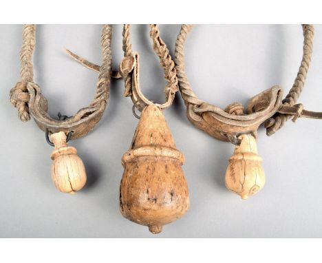 Three Maasai goat charms Kenya with a bone girdled tear drop shaped pendant with a metal ring and plated leather collar the l