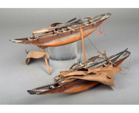 Two Polynesian model outrigger canoes wood bound with fibre and with sails 37.7cm long. (2)