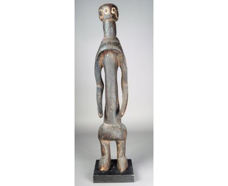 A Mumuye figure Nigeria with white pigment to the eyes and ears 84.5cm high on a stand.  Provenance Ian Auld London. 
