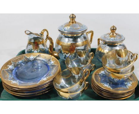 A Venetian enamelled blue glass coffee service, enriched with gilt and floral enamels, comprising six cup, saucer and plate t