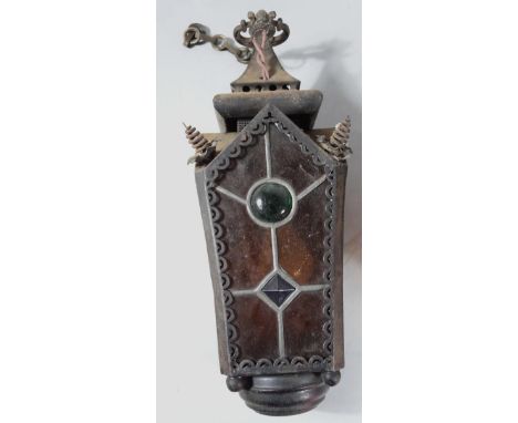 An early 20thC glass lantern, with shaped top, swing handle, glass panelled centre and circular base, 40cm high.