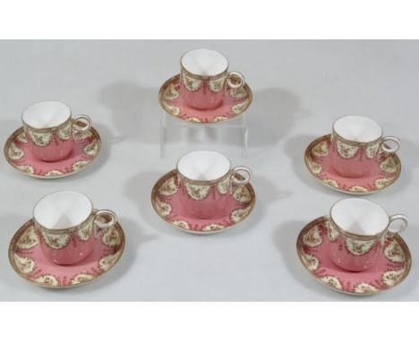 A late 19thC Royal Worcester coffee set, comprising cups and saucers, each decorated with garlands on a pink and cream ground