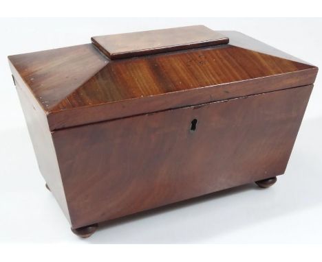 A mid 19thC mahogany sarcophagus shaped tea caddy, the lid hinging to reveal a plain interior (now a jewellery box), on belli