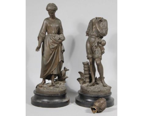 A pair of 19thC hollow cast bronze figures of a lady and gentleman, each dressed in finery, she aside pineapple, each on inve