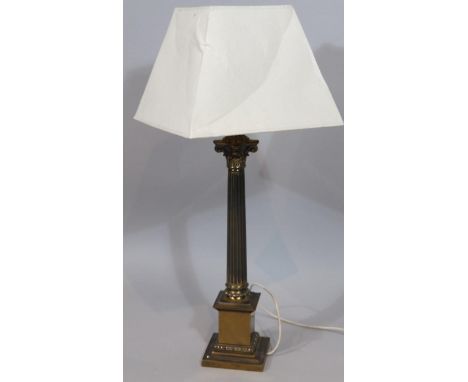 A modern table lamp, with brass Corinthian column on stepped base with modern cream shade, 84cm high.