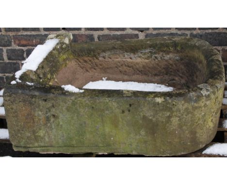 A 19thC pump stone pump trough base, of D-end outline, with open well, 25cm high, 79cm wide, 65cm deep.