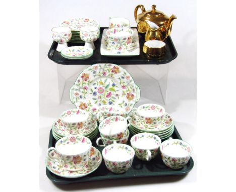A Minton Haddon Hall pattern part service, to include serving dish, 29cm wide, cups, saucers, plates, jug, etc., and a gilt c