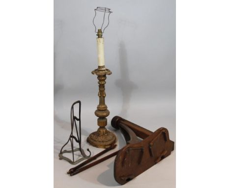 A 19thC gilt wood candlestick, with a floral dish holder, inverted stem, leafy base on scroll feet with later fittings, 110cm