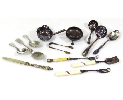 A small collection of silver and silver plated items, to include a silver ladle handle, silver plated forks, silver toddy lad