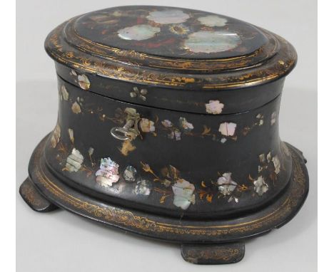 A Victorian papier maché and mother of pearl tea caddy, the oval lid heavily decorated with flowers with an outer gilt border
