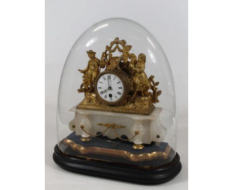 A 19thC gilt metal mantel clock, the 8cm dia. Roman numeric dial, revealing a key wind movement, flanked by figures of farm h