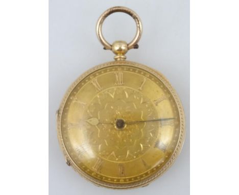 An 18ct gold open faced fob watch, with Roman numeric fancy 4cm dia. dial, baton pointers and an engine turned case, revealin