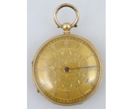 An 18ct gold open faced fob watch, with Roman numeric fancy 4cm dia. dial, baton pointers and an engine turned case, revealin