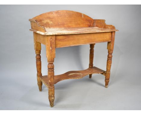 A Late Victorian Stained Pine Wash Stand with Shaped Stretcher Shelf and Turned Supports, Galleried Back, 88cms Wide
