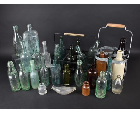 A Collection of Various Vintage Glass and Stoneware Bottles Together with Two Bottle Carriers