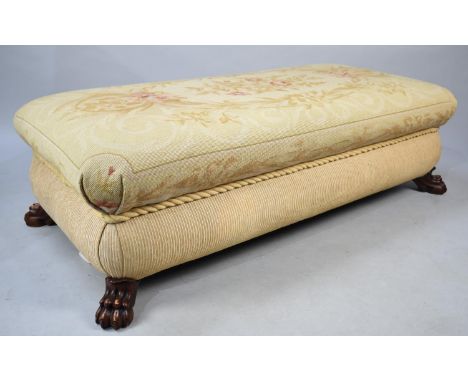 A Large Rectangular Tapestry Covered Footstool with Four Claw Feet, 120cms by 60cms