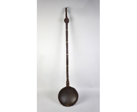 A Cast Iron Brass Mounted Ladle, 76cms Long