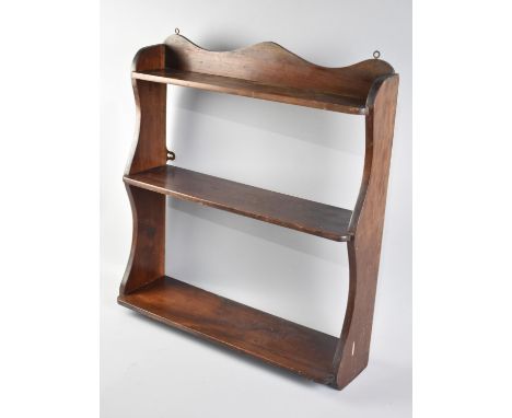 An Edwardian Mahogany Wall Hanging Three Shelf Unit, 50cms Wide