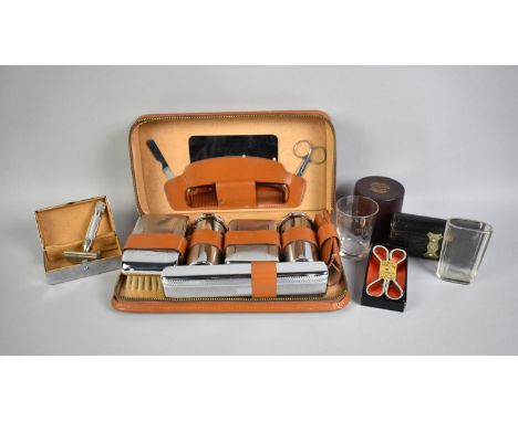 A Collection of Various Leather Cased Travelling Sets, Cased Medicine Glass, Cased Razor, Arm Bands and Cased Glass