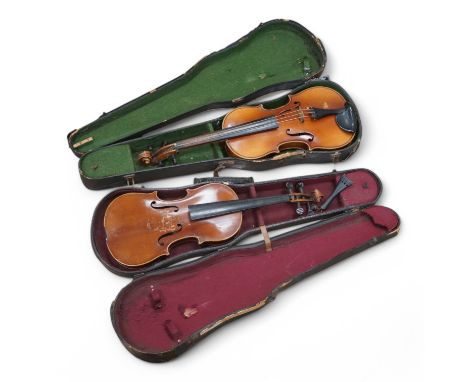 Two cased violins, one bearing a Stradivarius label