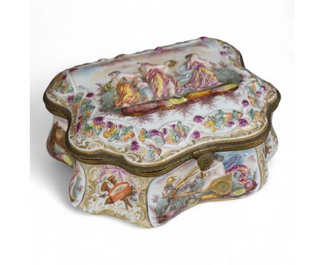 An ornate Neapolitan Capodimonte porcelain box with gilt mounts, 22cm wide, 11cm high