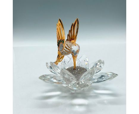 Part of the original Gold series of figurines, bird feeding off clear crystal center of flower. Birds body and wings are gold