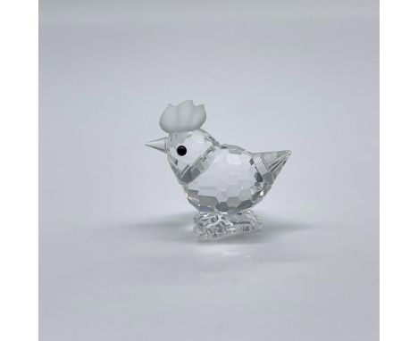 Part of the Barnyard Friends collection. A clear crystal figure of a chicken with a frosted comb and black eyes. Swarovski sw
