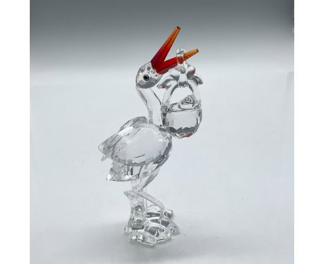 Part of the Cheerful Times series this clear faceted crystal figure has a Fire opal beak. Basket and baby is polished clear c