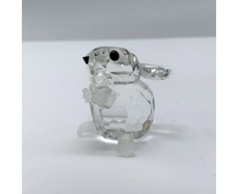 An adorable field mouse with frosted feet, paws, and tail, gazing up in awe with striking black crystal eyes. Swarovski backs