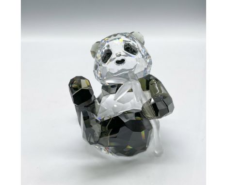 Beautiful clear and black crystal figurine sitting on his bottom while snacking on a bamboo stick. Swarovski backstamp. 90554