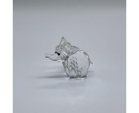 Part of the African Wildlife series. A clear crystal figure of a happy elephant with frosted tail and black eyes. Swarovski s