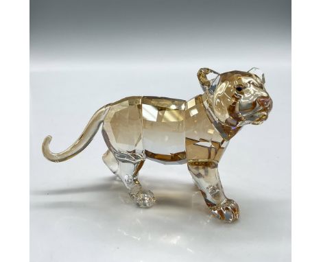 Shimmers in fully facetted golden shine crystal with satin crystal stripes. Swarovski backstamp. 1016677. Item comes with ori