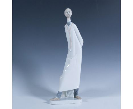 Glossy finish depicting a doctor standing. Lladro backstamp. This item has its original box which measures 16"L x 6.5"W x 6.7