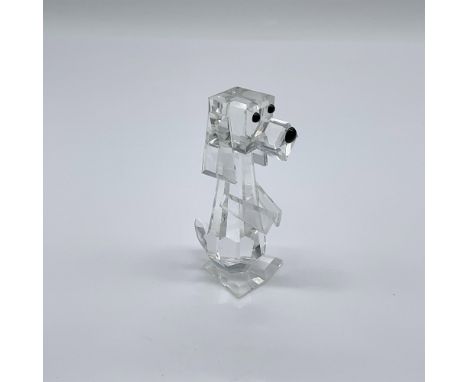 Also known as Pluto. A clear crystal dog with black crystal eyes and nose. Swarovski Silver Crystal mark. This item has its o